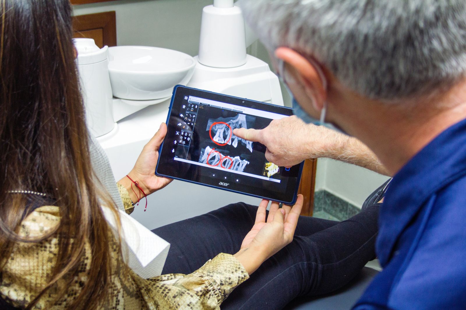 Photograph of Periodontist discussing X-rays with patient, Muncie, IN